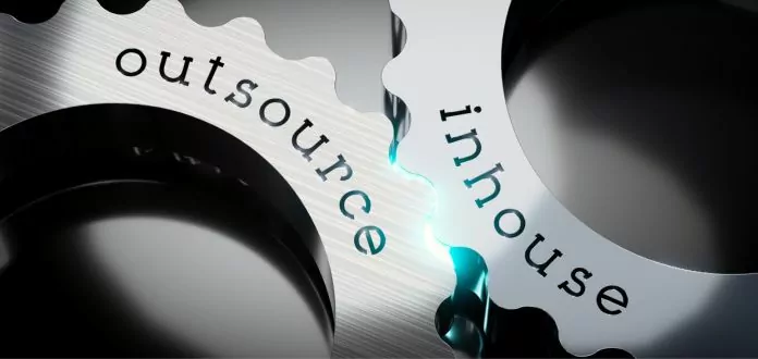 Gears with in-source and outsource labels for strategic outsourcing management