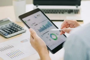 Infographic with various charts on a tablet.
