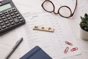 Glasses and documents on a desk for Supply Chain analysis and planning activities
