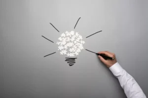 Lightbulb drawn on a blackboard for ideas and innovation in Supply Chain processes