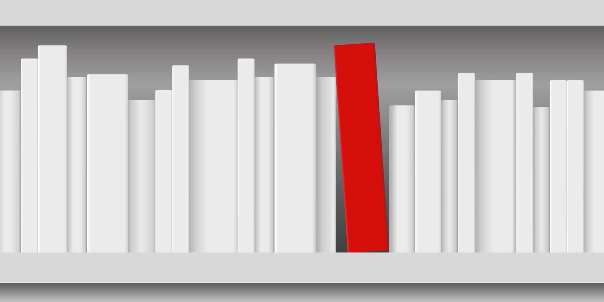 Un libro rosso posato su uno scaffale di libri bianchi.